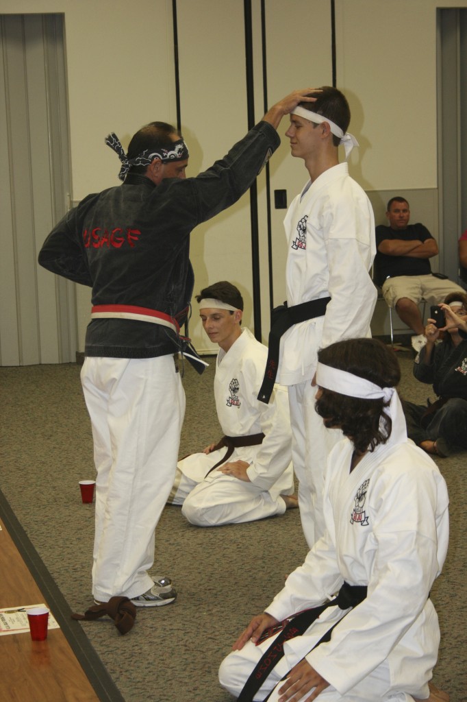 Sensei David Schopp promoting Grant Stemler to Shodan